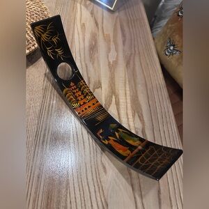 Asian wooden wine bottle holder.